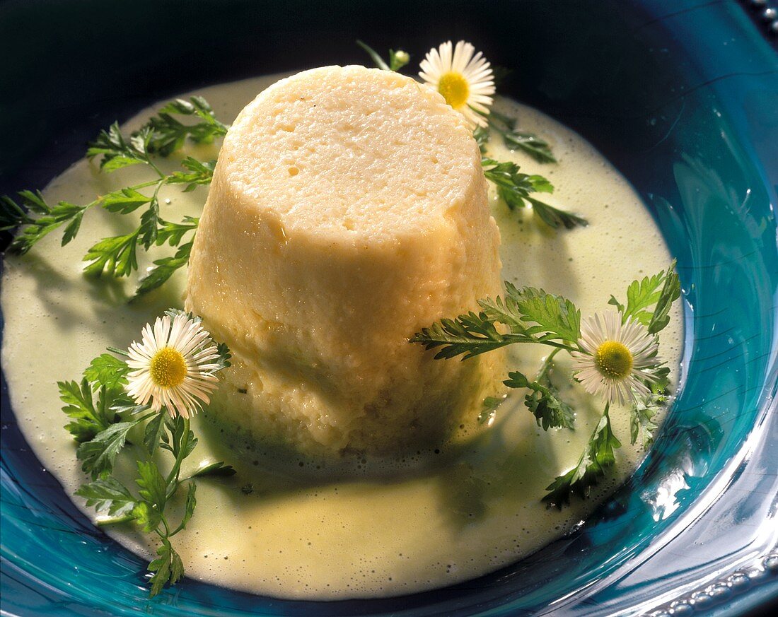 Parsley flan with cheese sauce & daisies