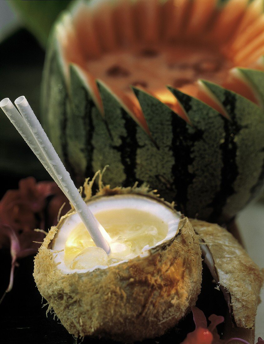 Tropical Cocktail in a Coconut; Straws