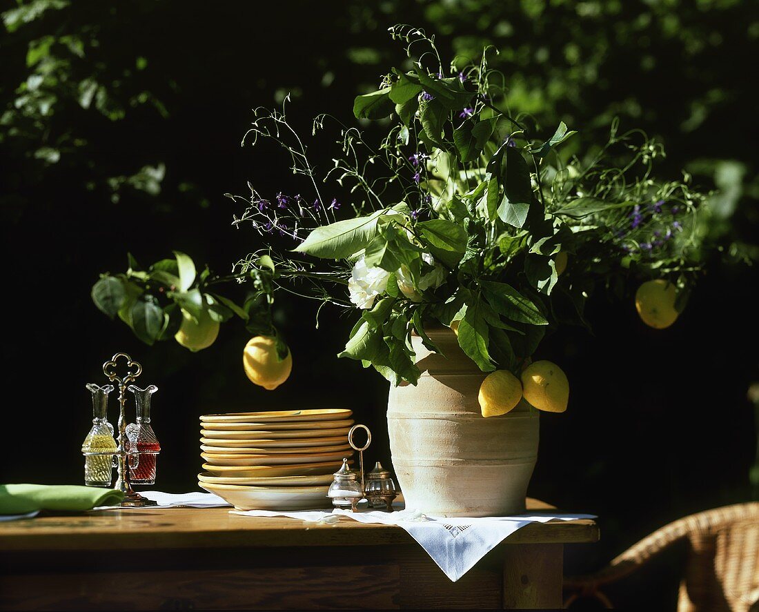 Lemon bouquet in terracotta vase on buffet table
