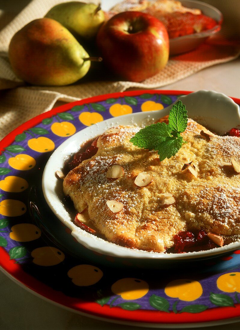 Pear and apple brulee with cranberries and hazelnuts
