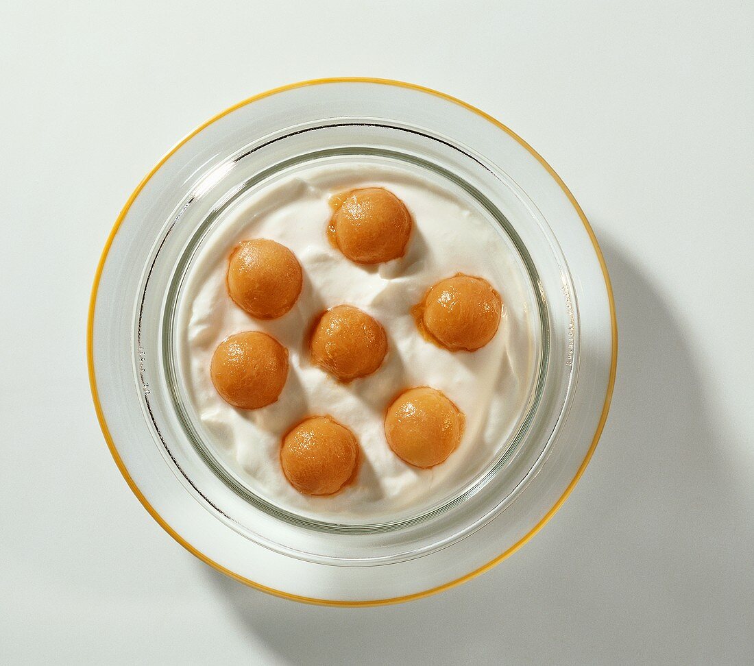 Honeydew melon balls on quark mousse