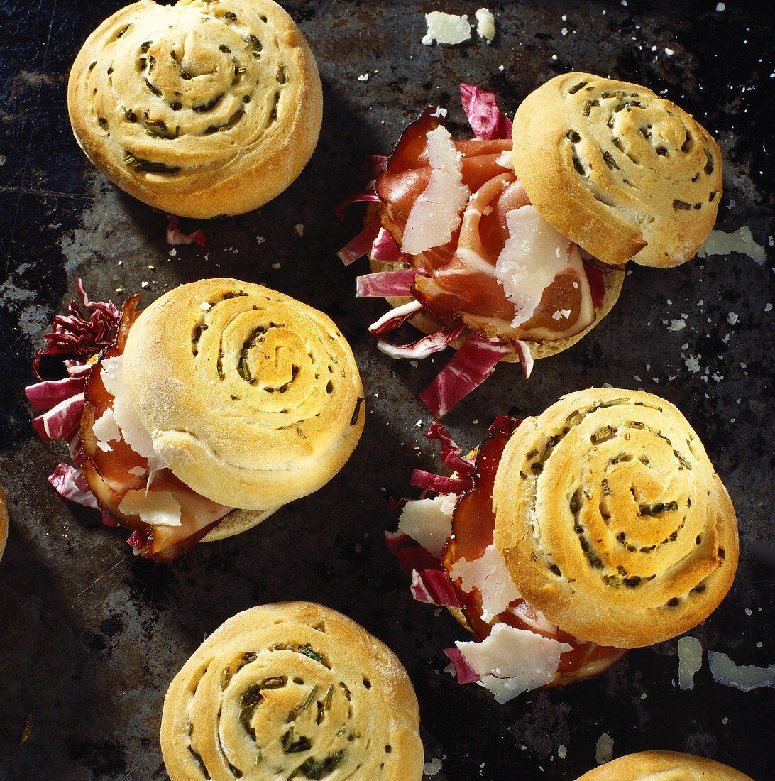Filled radicchio rolls with ham and Parmesan shavings