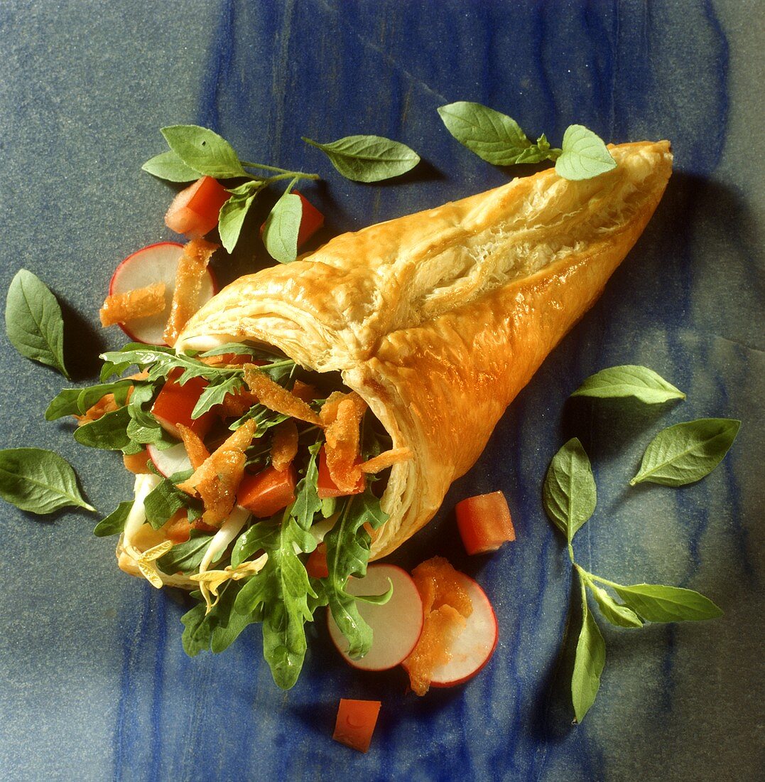 Puff pastry cone filled with salad and vegetables