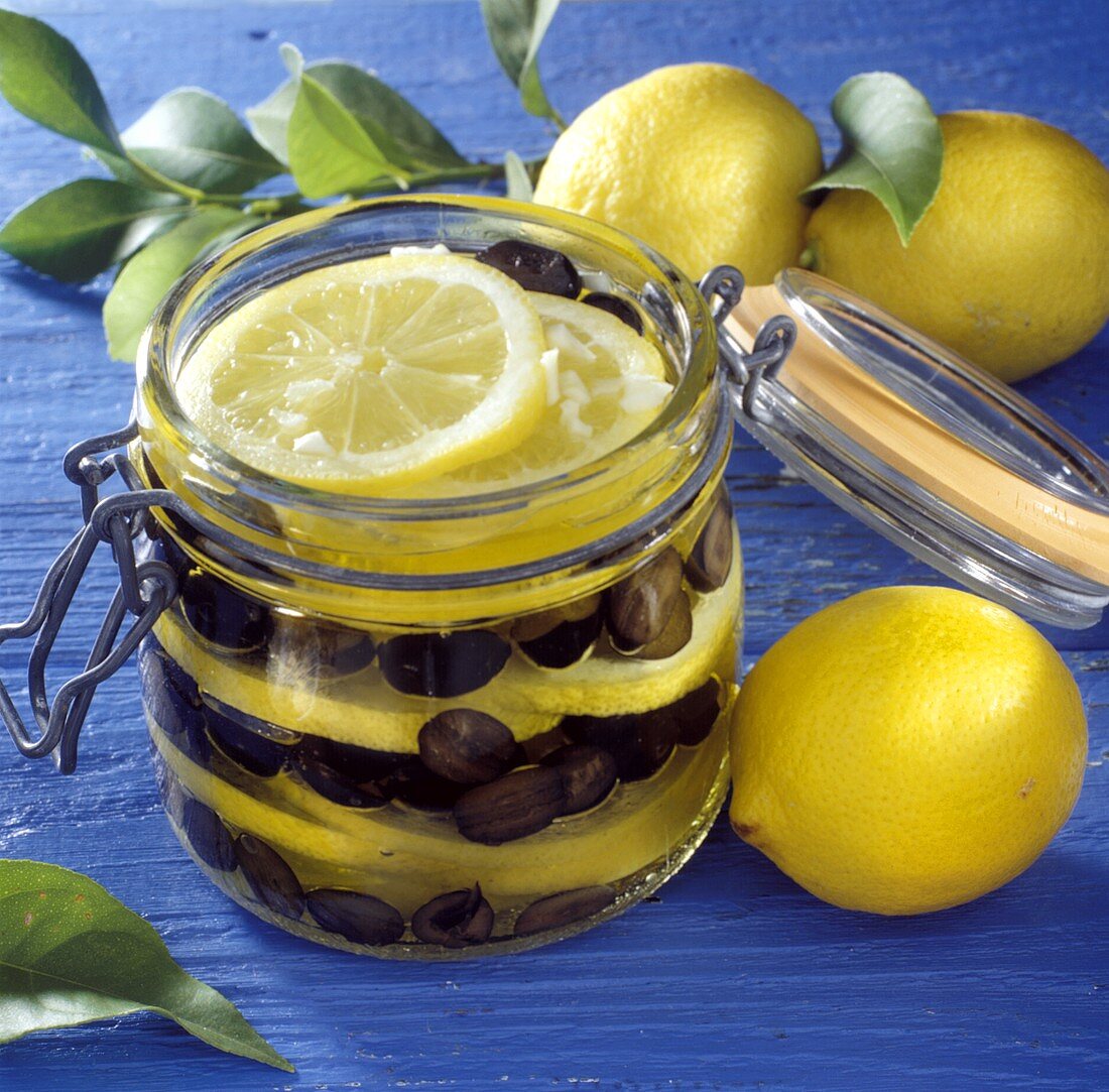Bottled lemon slices and olives in jar