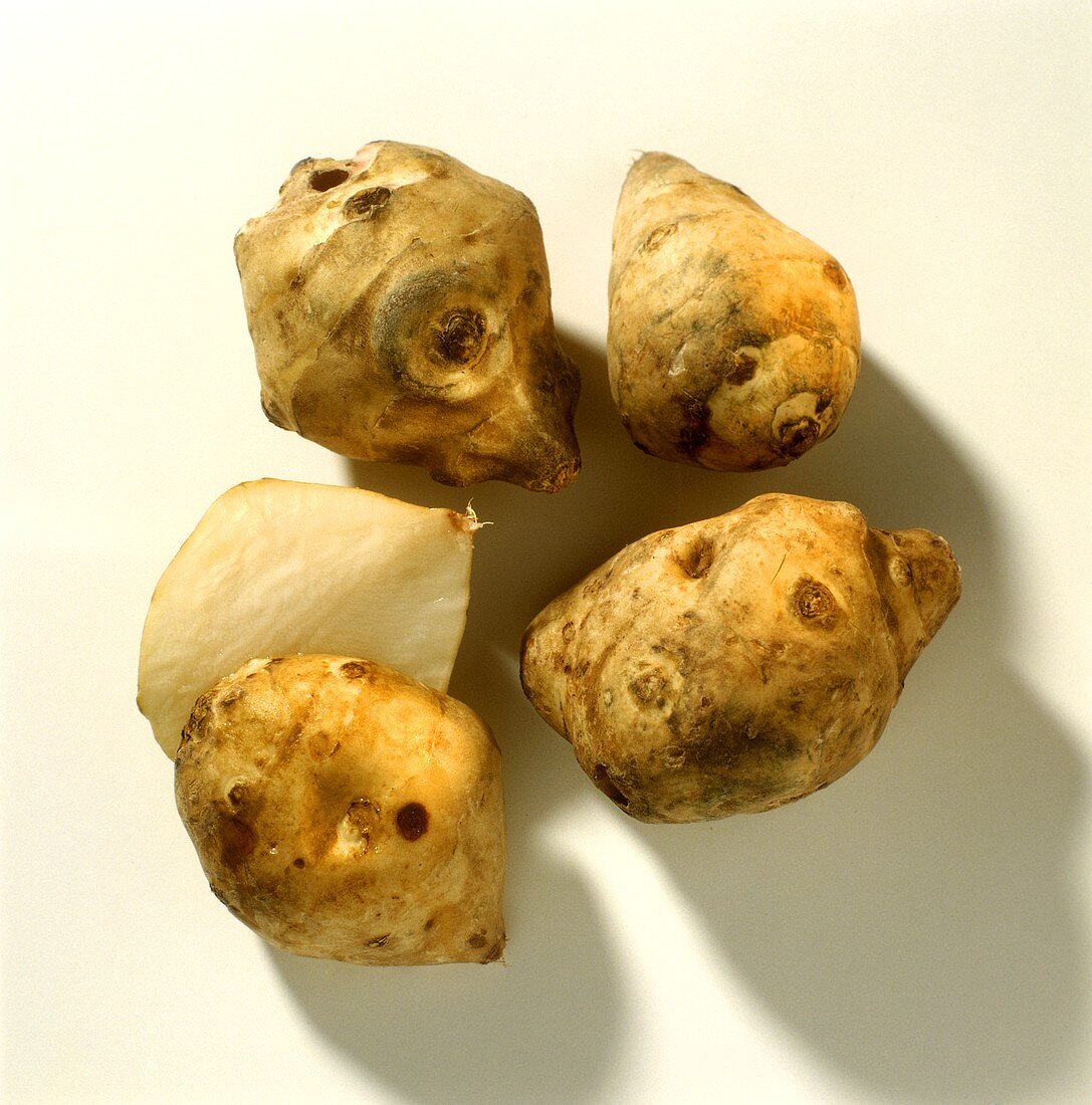 Four Jerusalem artichokes, one halved