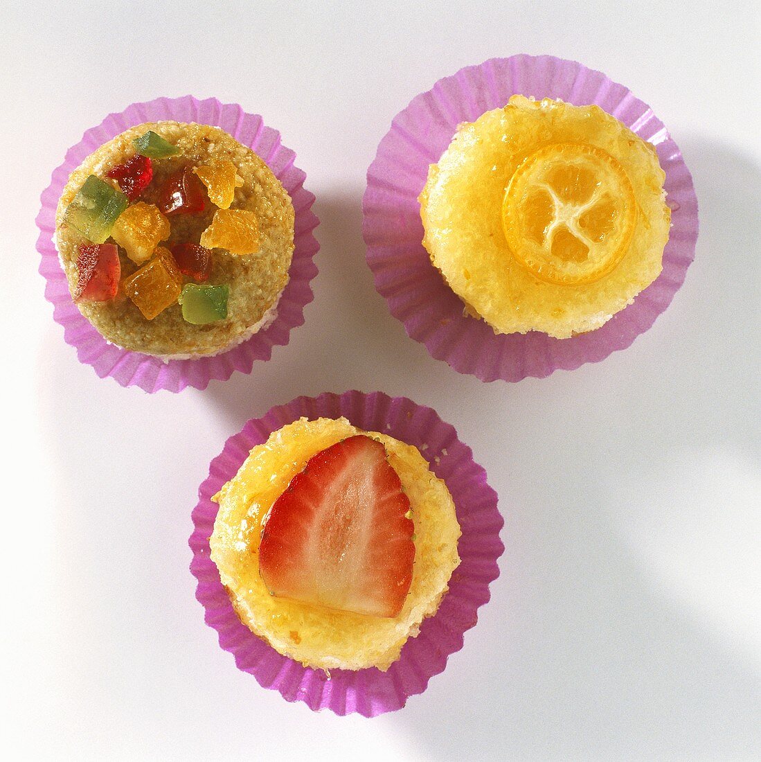 Strawberry sweet and candied fruit in paper cases