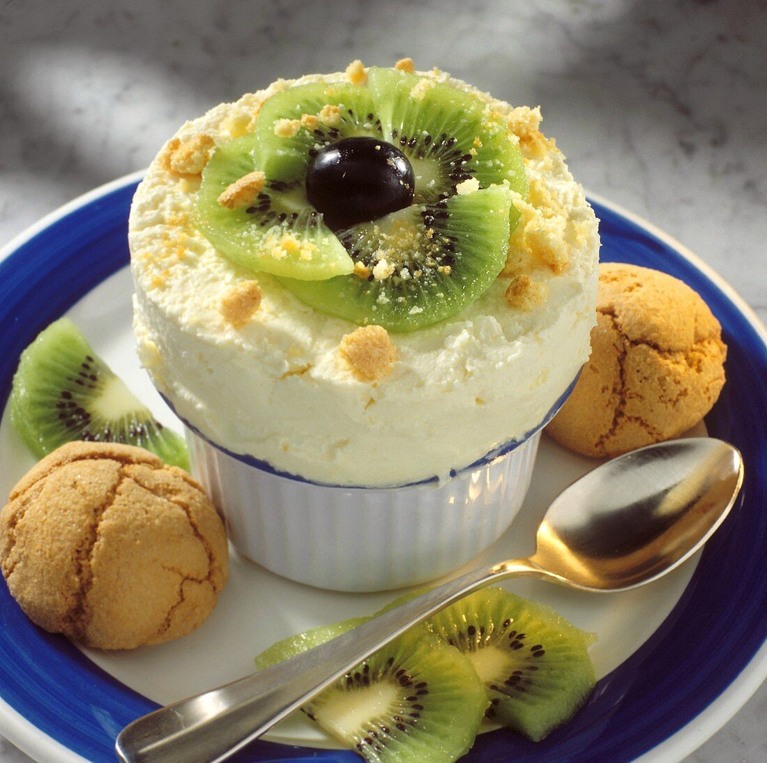 Ice cream souffle with kiwi slices, red grapes & biscuits