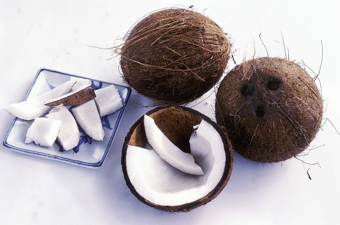 Whole coconuts and coconut pieces
