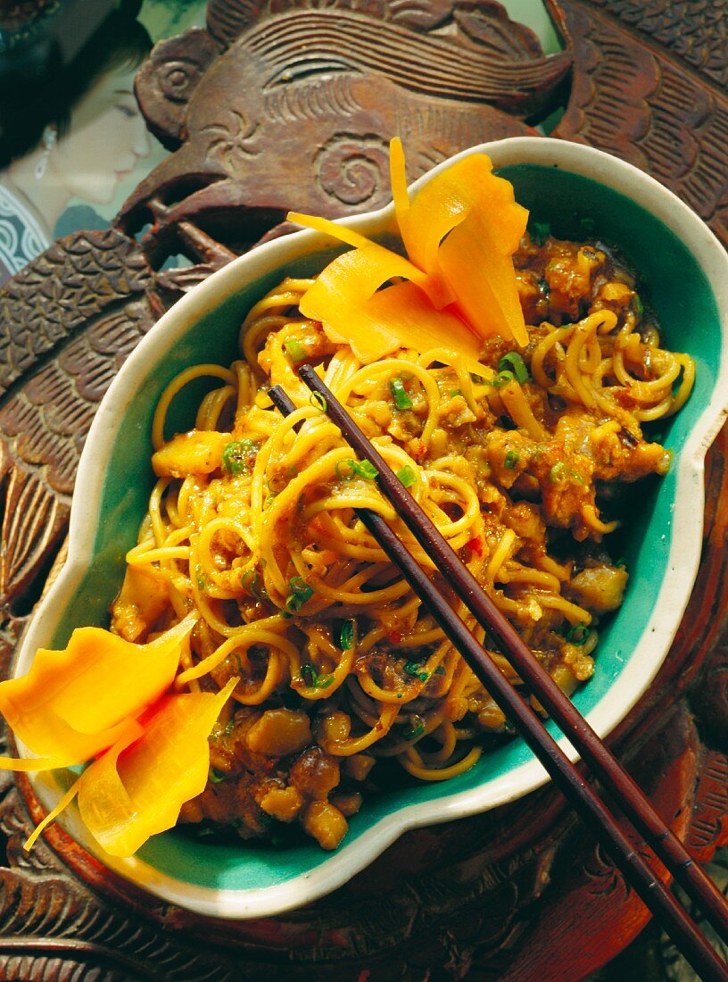 Noodles in fish sauce with carrot butterflies