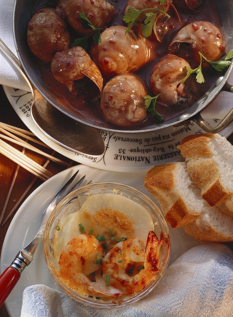 Snails in red wine sauce and baked eggs with shrimps