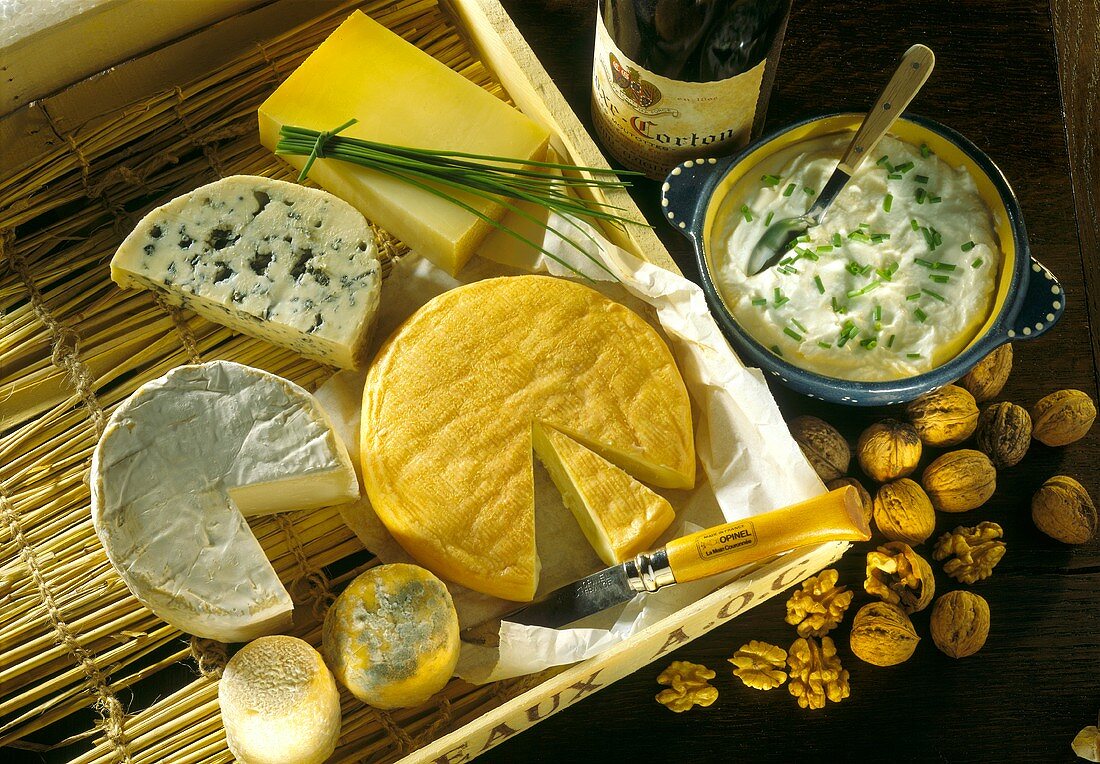 Various types of French cheese & several walnuts