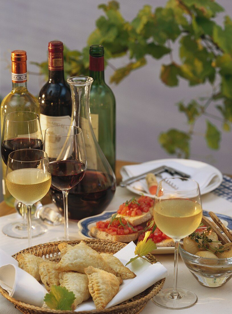 Table laid with various appetisers, wine