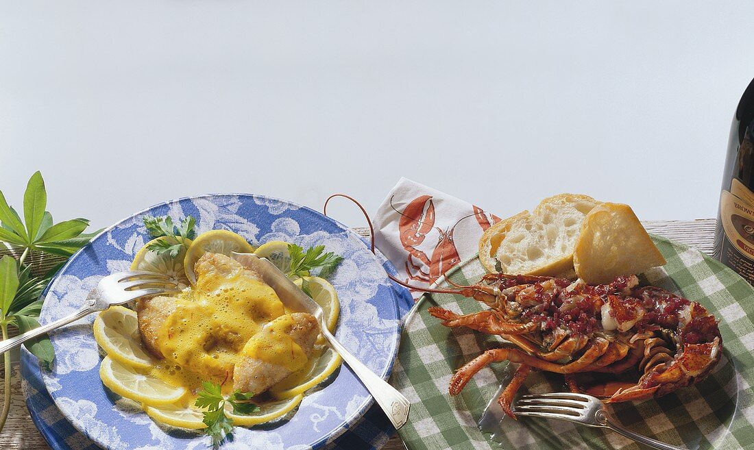 Fish with lemon sauce and baked lobster with white bread