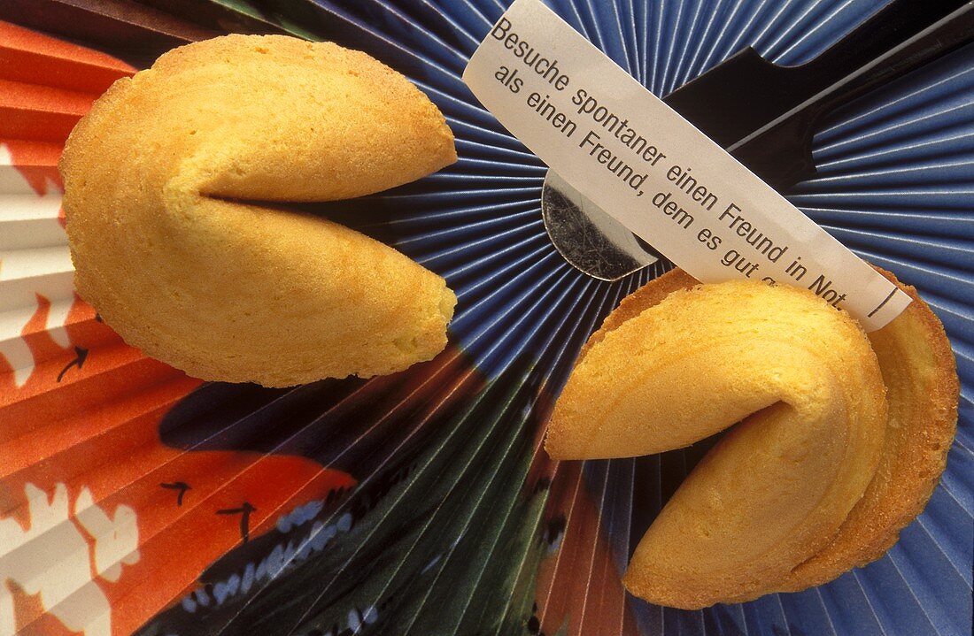 Chinese fortune cookies with paper strips on fan