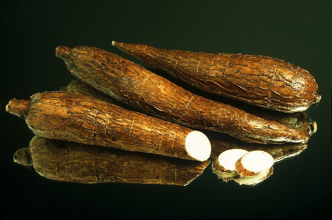 Two whole and one cut cassava