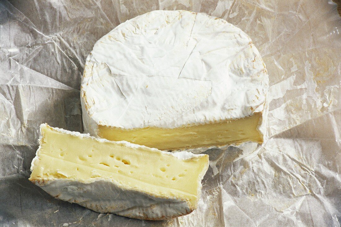Camembert Cheese with a Piece Cut Out