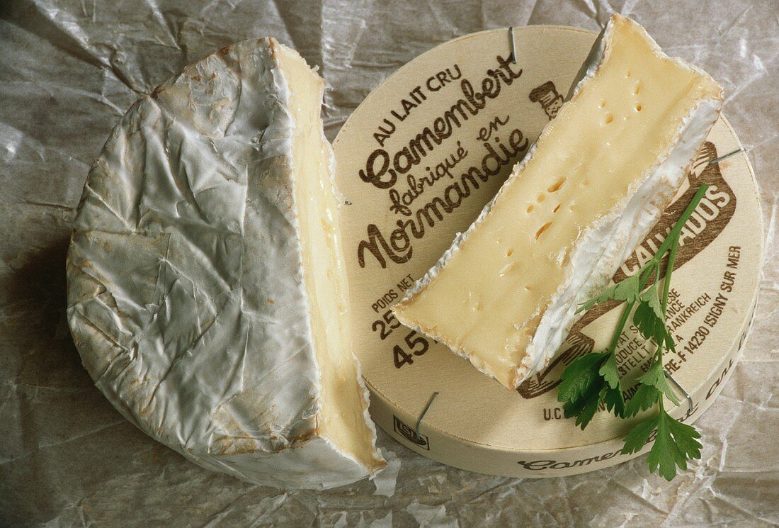Camembert, cut into, on wrappings