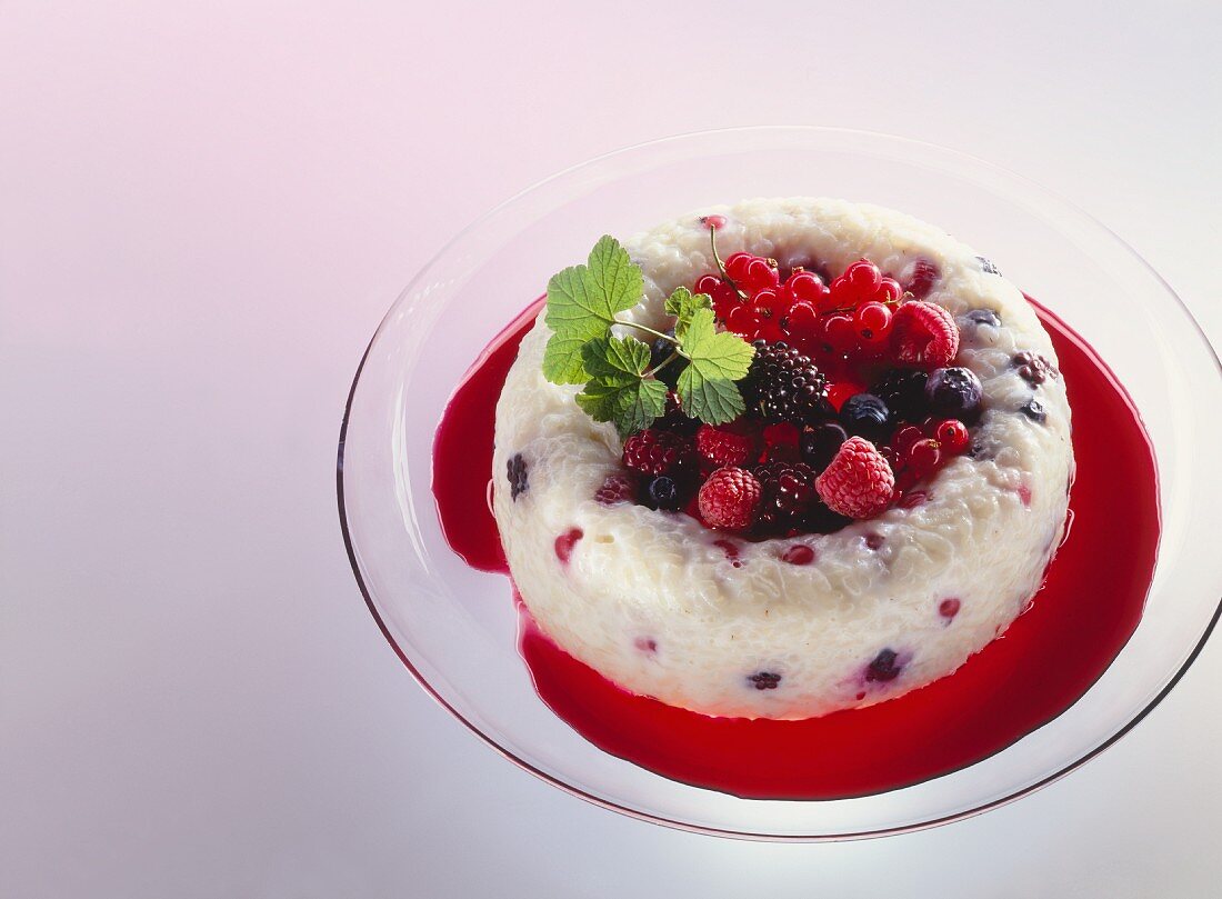 Rice pudding with mixed berries & blackberry sauce