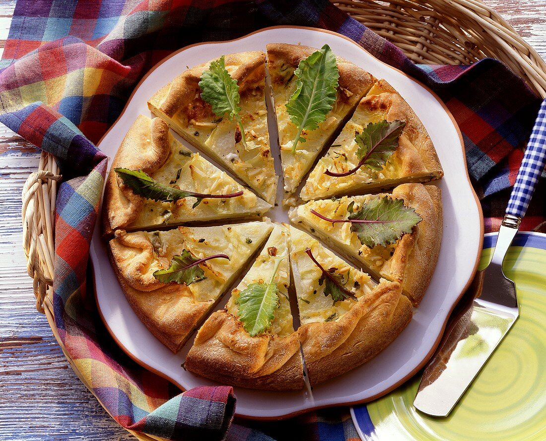 Kohlrabi tart with Parmesan, almonds & kohlrabi leaves