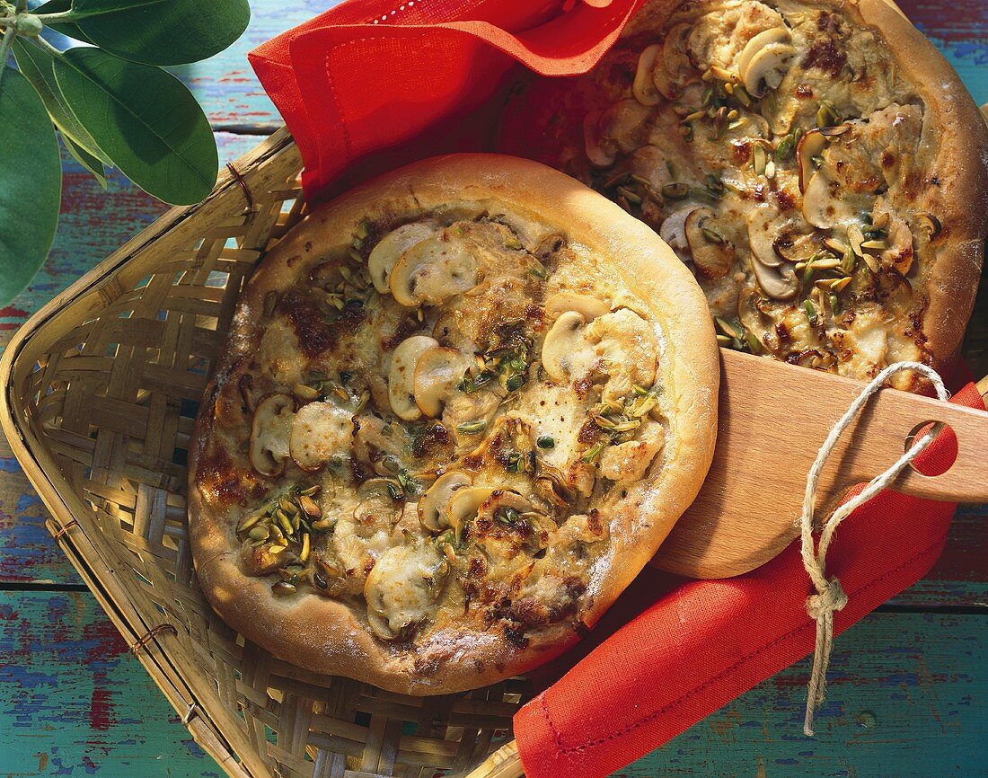Mushroom & turkey pizza with pistachio kernels