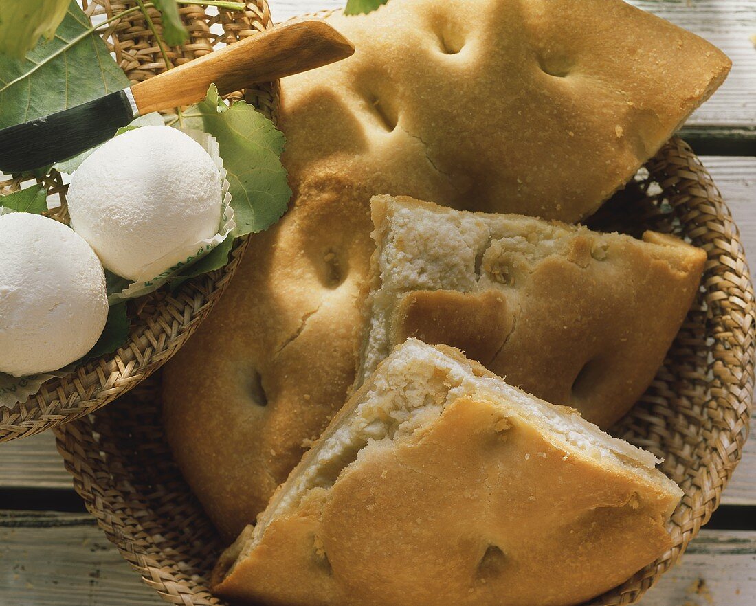 Focaccia (flat bread) with fresh goat's cheese in basket