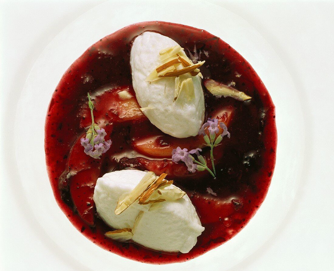 Elderberry soup with poached meringues, apples & flowers