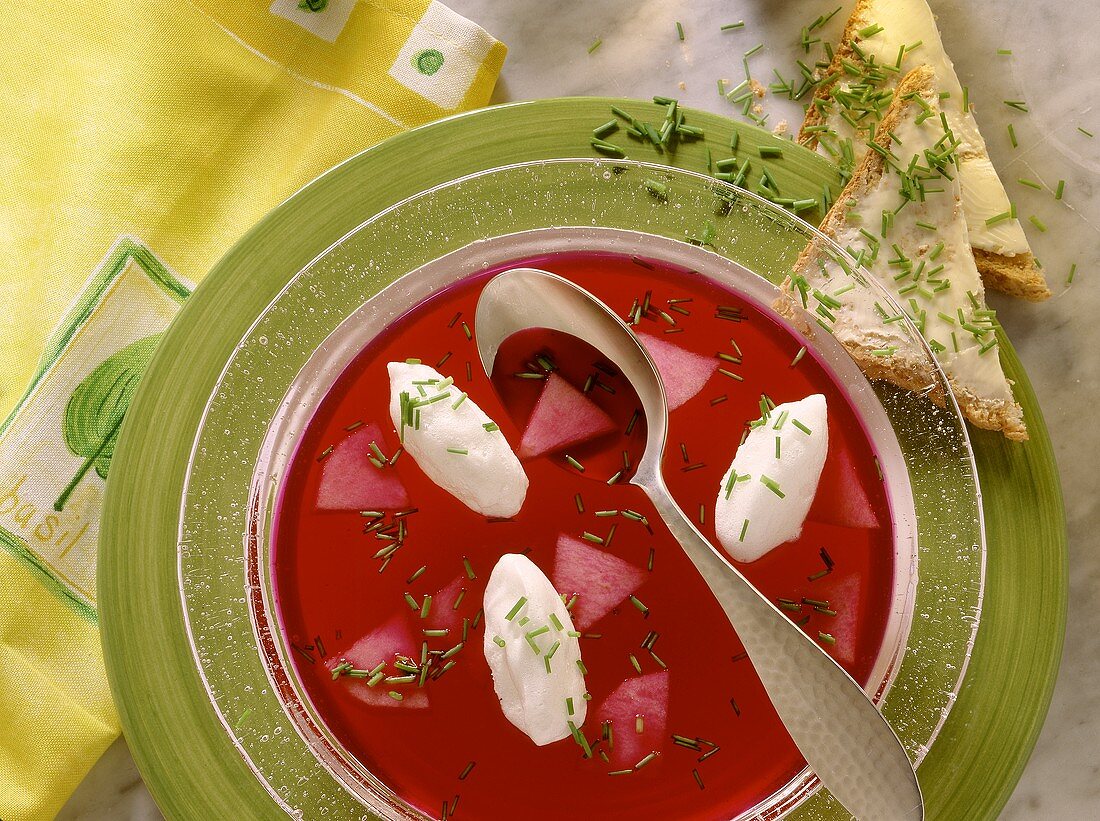 Beetroot consomme with egg white dumplings & apple slices