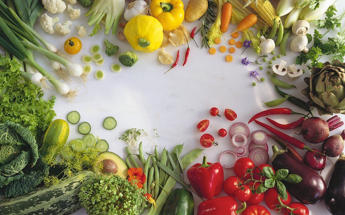 Various types of vegetables around edge of picture