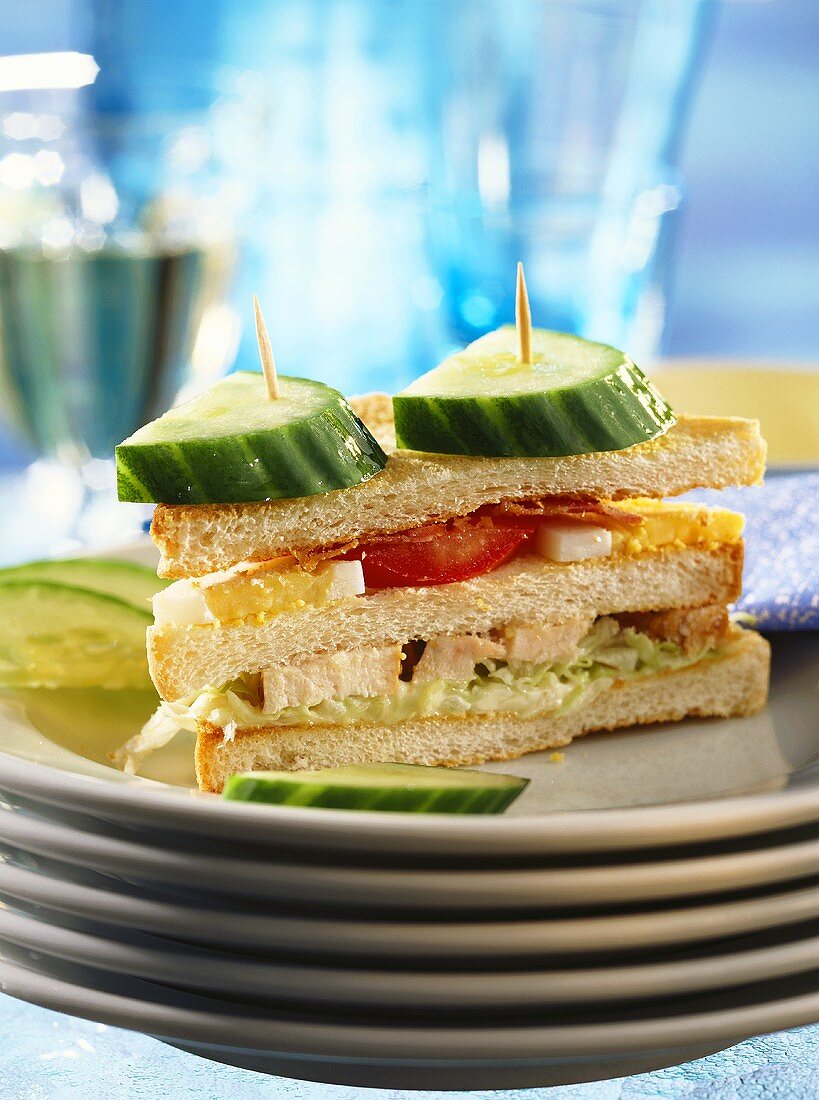 Club sandwich with chicken, eggs, tomatoes & cucumber