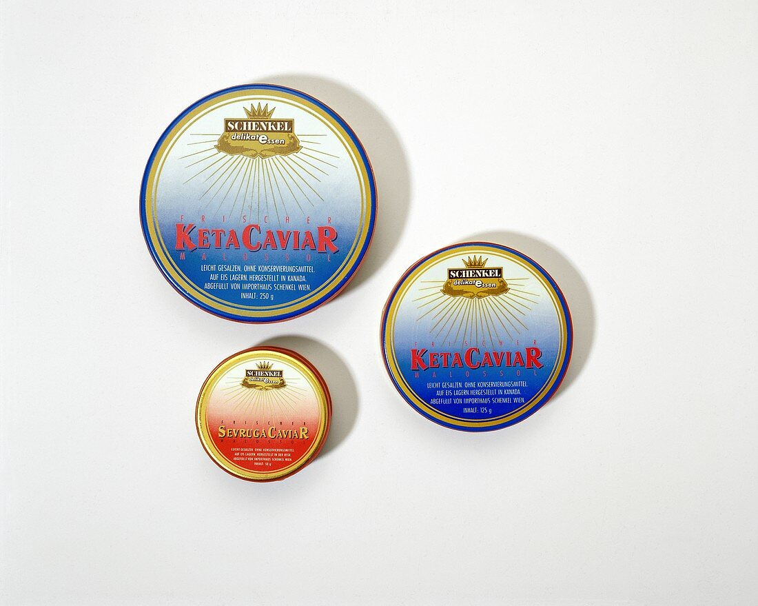 Two cans of Keta caviar and a can of Sevruga caviar