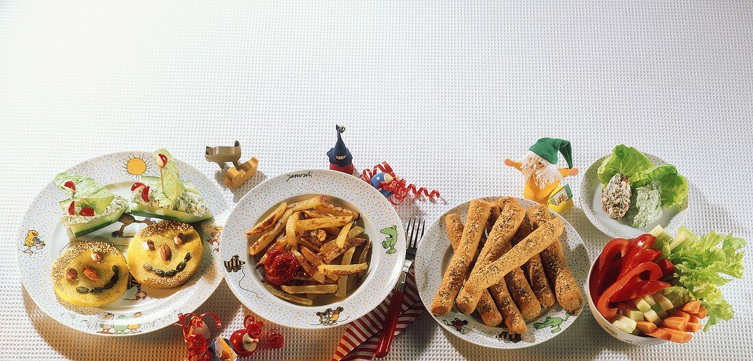 Menu: polenta faces, chips, cheese sticks, raw vegetables