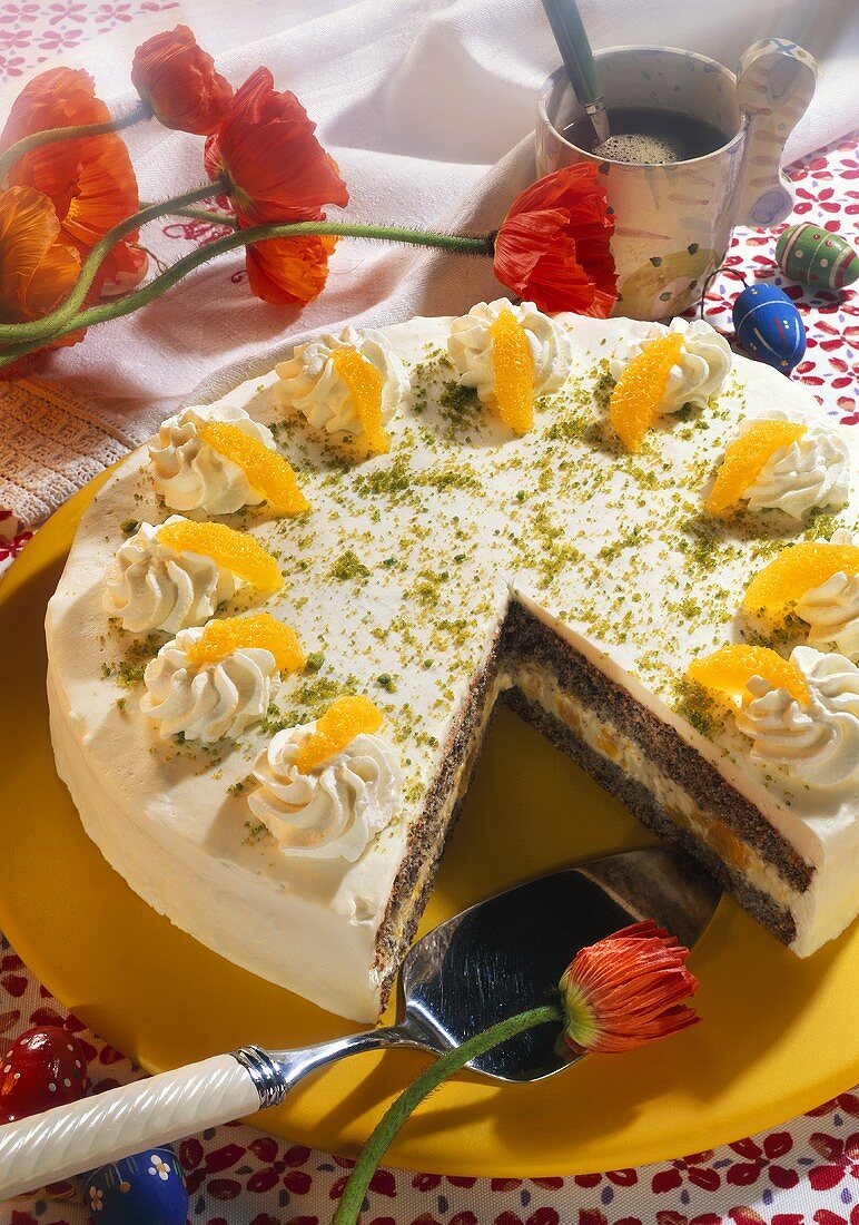 Easter cake with poppy seeds, orange segments & pistachio