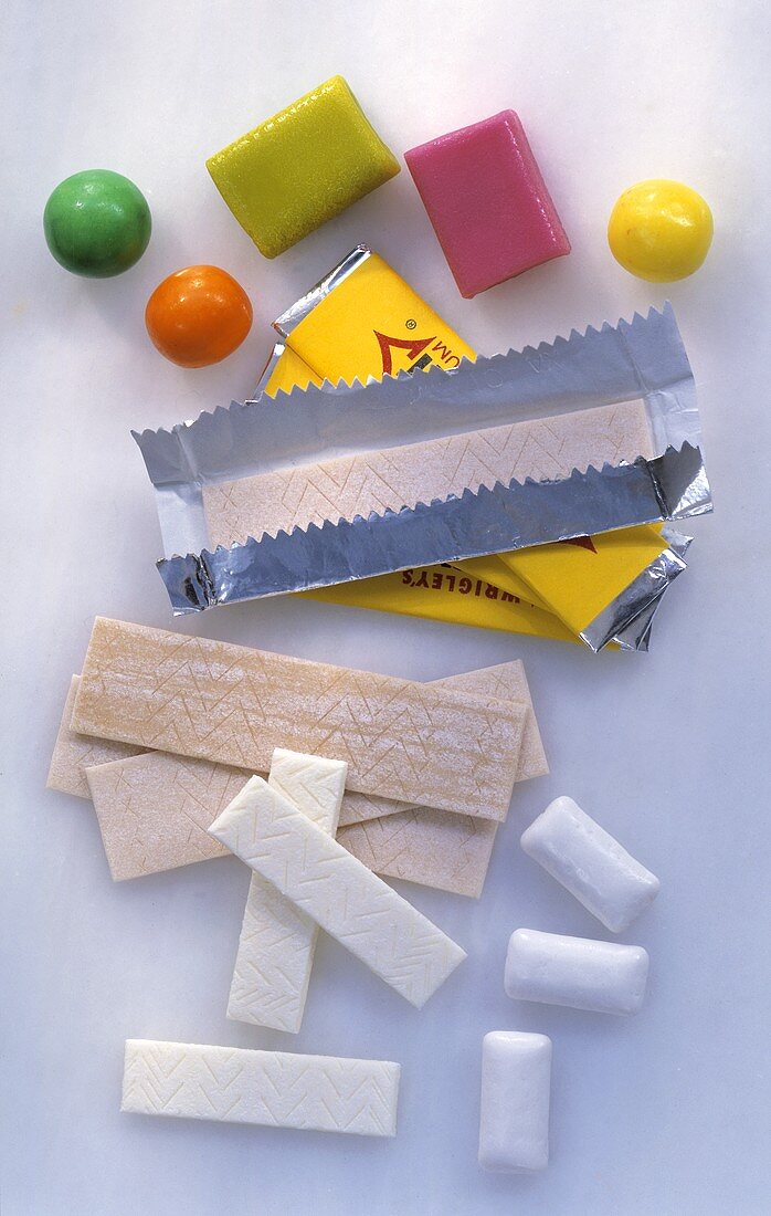 Various types of chewing gum, some in wrappers