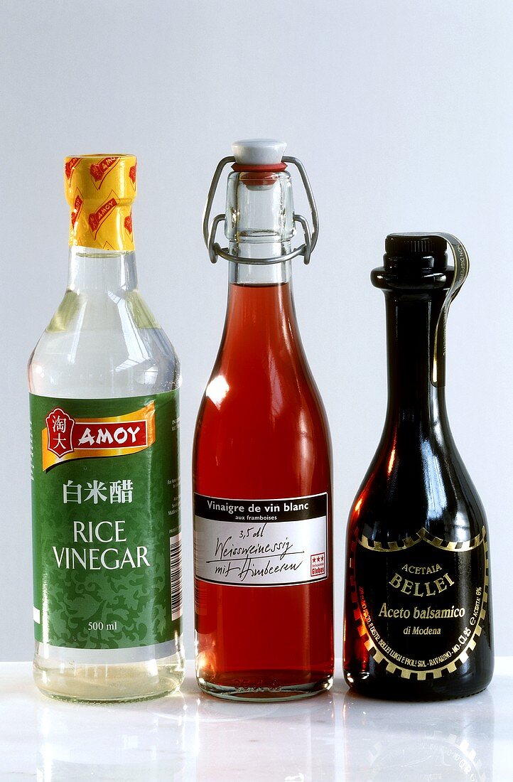 Rice, raspberry and balsamic vinegar in bottles