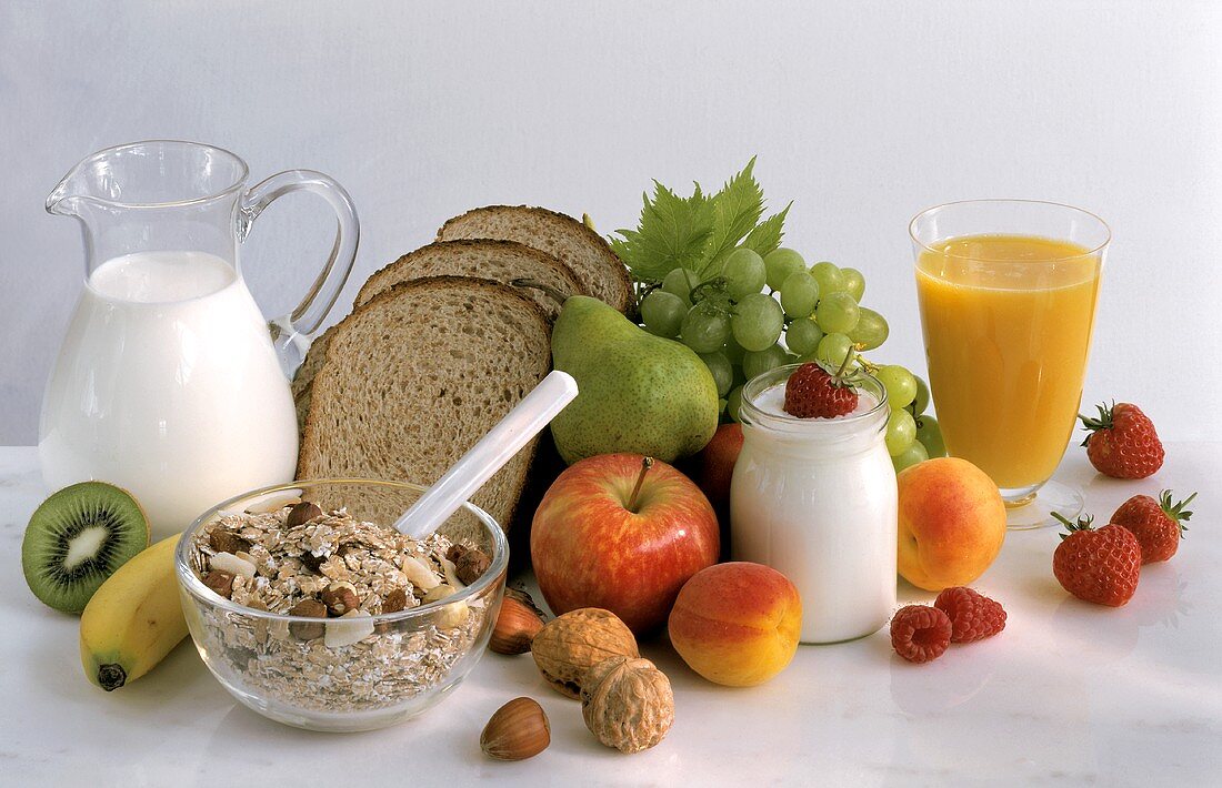 Ingredients for healthy breakfast (muesli, fruit, milk, juice)