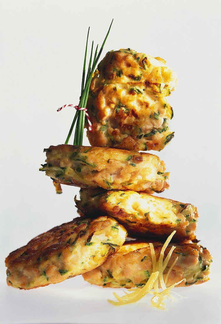 Salmon rissoles with tarragon and mustard butter, in a pile