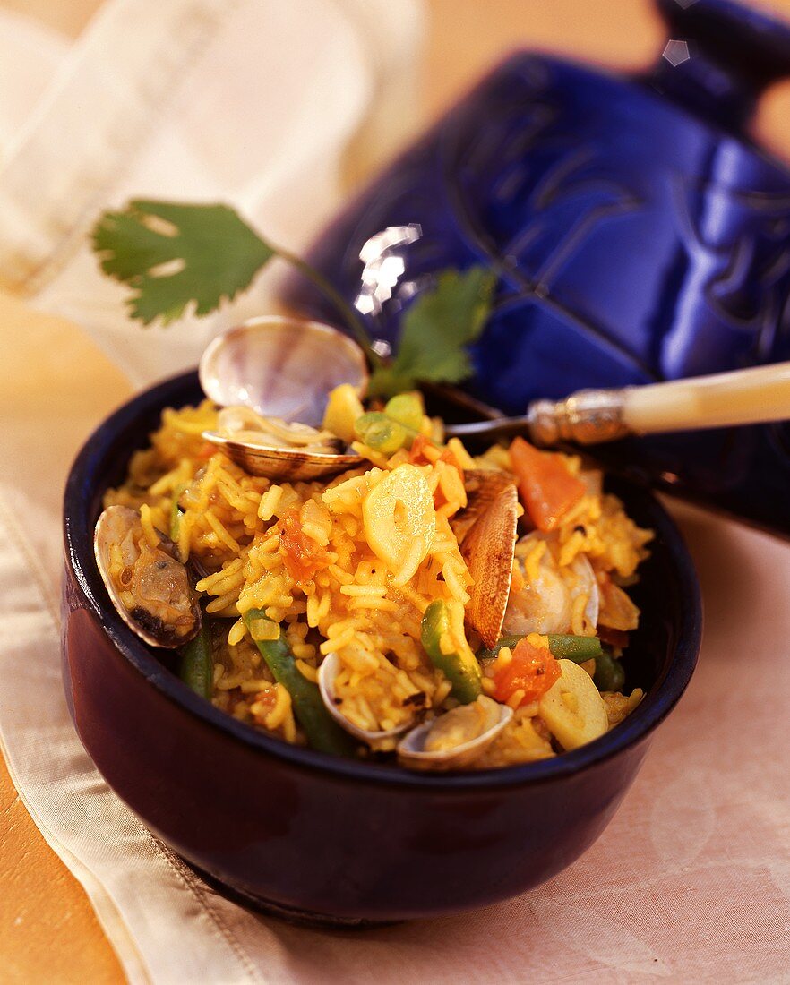 Moroccan spiced rice with mussels in blue bowl