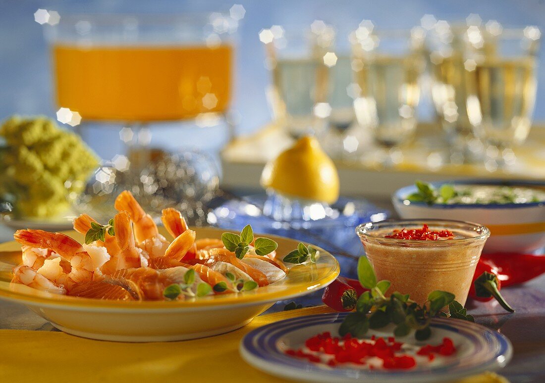 Fondue with shrimps and fish on plate and chili dip