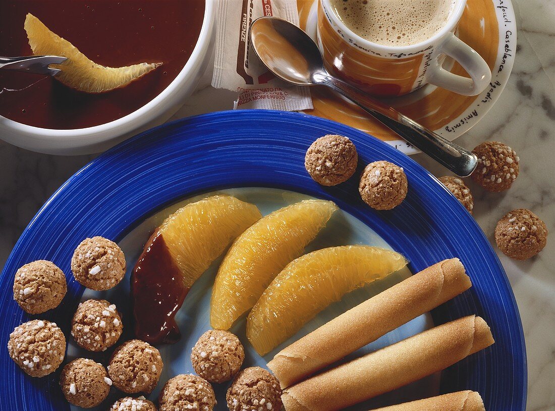 Cappuccino fondue with orange segments, amarettini & wafers