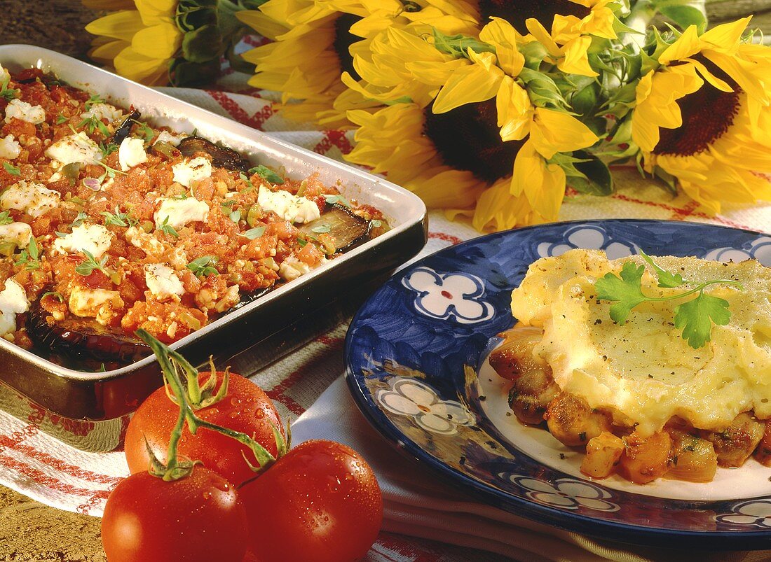 Moussaka in baking dish; Shepherd's pie with mashed potato