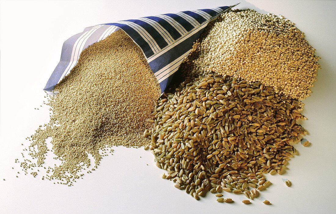 Various types of cereal, including millet in paper bag