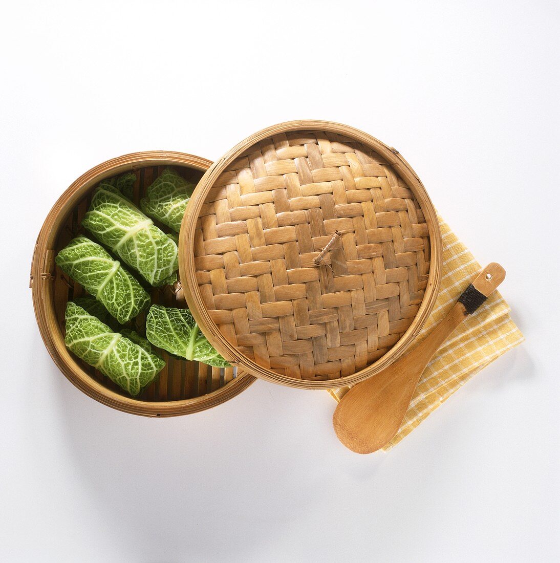 Asian steaming basket with savoy rolls, napkin