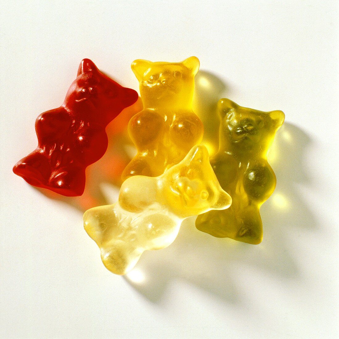 Four gummi bears (jelly bears) in various colours