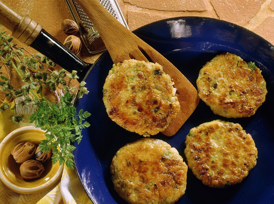 Oat burgers in a frying pan