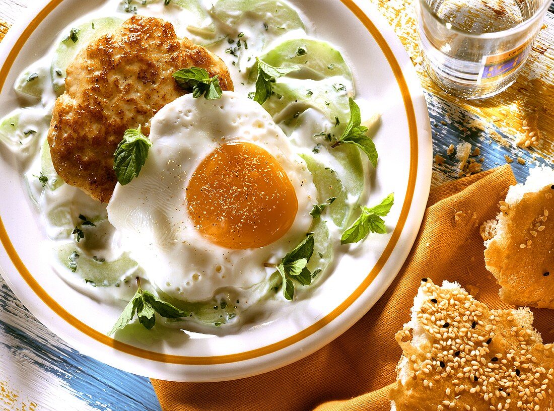 Poultry frikadellas, fried egg & yoghurt sauce with cucumber