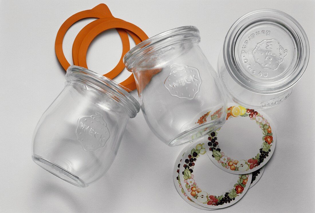 Three empty preserving jars, labels & wide elastic bands