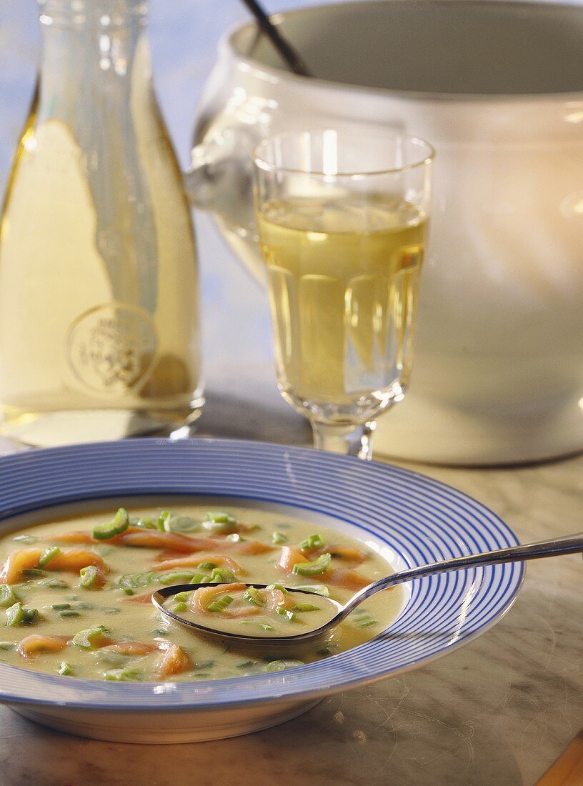 Potato soup with salmon and spring onions