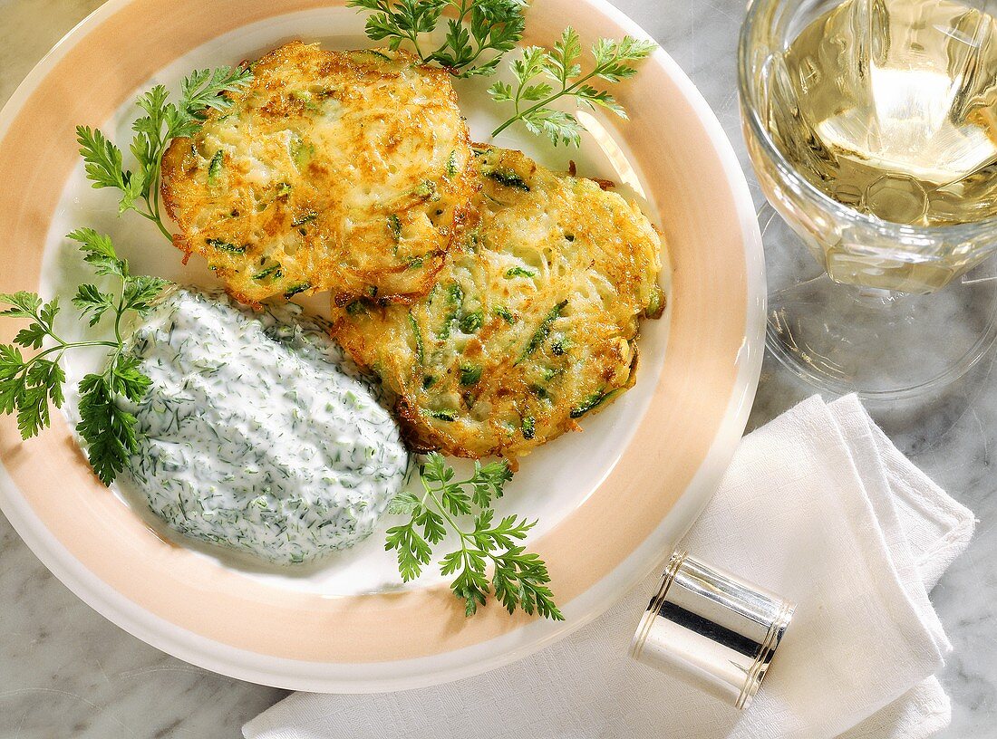 Small courgette & potato pancakes with yoghurt & herb sauce
