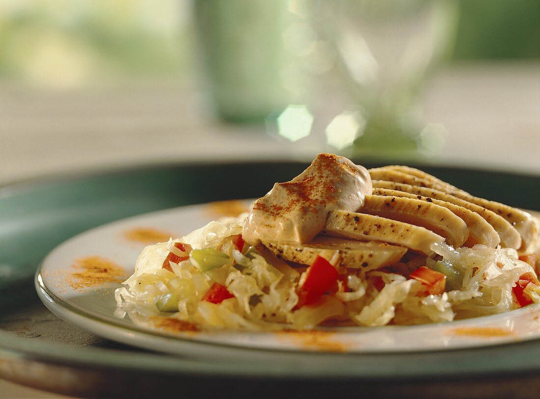 Sliced turkey breast on sauerkraut & pepper salad