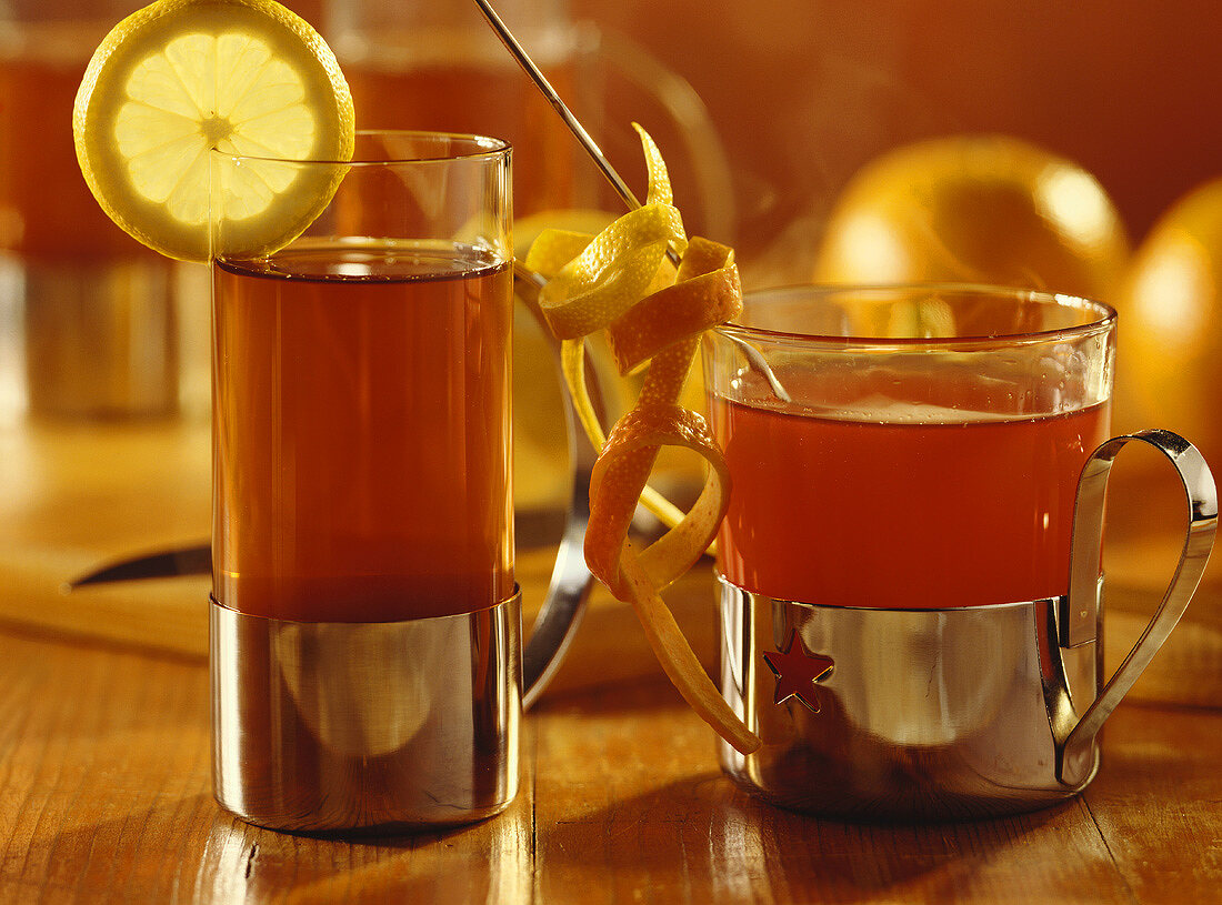 Lemon & elderberry tea & wine & orange punch in tea glasses